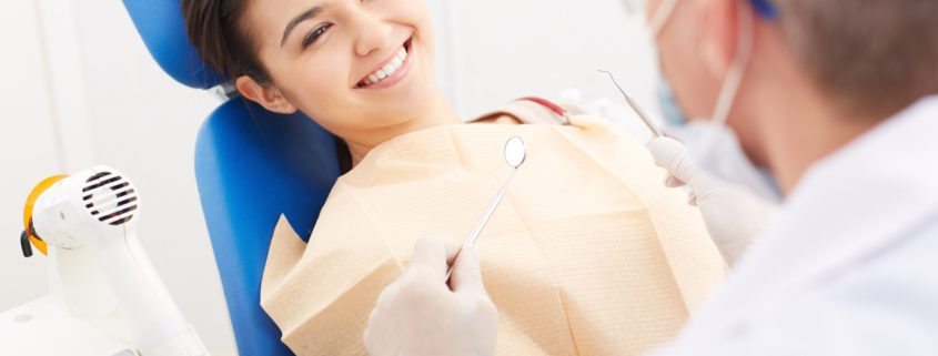 smiling during dental checkup
